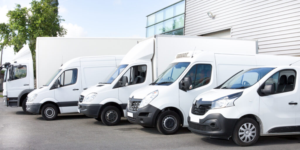 several-vans-trucks-parked-parking-lot-rent-1024x512